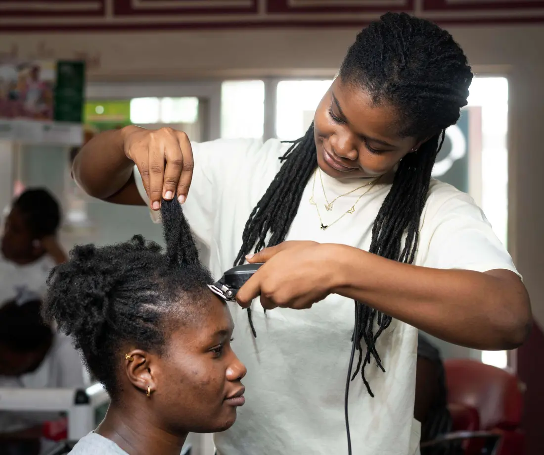 A stylist personally attending to a client’s hairstyle